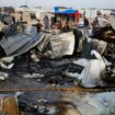 Palestinians look at the damages after a fire at the site of an Israeli strike on an area designated for displaced people, in Rafah in the southern Gaza Strip, May 27, 2024. REUTERS/Mohammed Salem