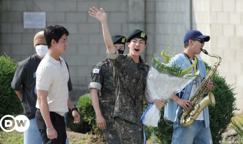 Kim Seok-jin shows a thumbs up gesture at Rockefeller Plaza in New York in 2020