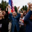 Supporters of French far-left opposition party La France Insoumise (France Unbowed - LFI) react after partial results in the second round of the early French parliamentary elections at Place Stalingrad in Paris, France, July 7, 2024. REUTERS/Yara Nardi