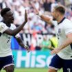 England's Bukayo Saka (left) celebrates with Luke Shaw during the quarter-final tie. Pic: PA