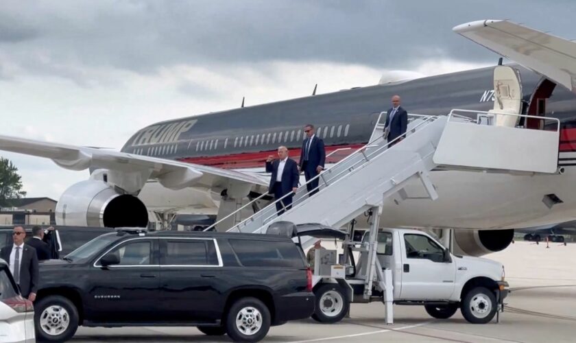 Republican presidential candidate and former U.S. President Donald Trump gestures as he arrives at Milwaukee Mitchell International Airport a day after he survived an assassination attempt at a rally in Butler, Pennsylvania, in Milwaukee, Wisconsin, U.S., July 14, 2024 in this screengrab obtained from a social media video. Dan Scavino Jr. via X/via REUTERS THIS IMAGE HAS BEEN SUPPLIED BY A THIRD PARTY. MANDATORY CREDIT. NO RESALES. NO ARCHIVES.