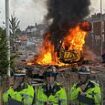 Anti-Muslim mob chanting 'English till I die' riot and burn police van outside mosque in Southport near where three girls were killed in knife attack: Police issue warning following 'sickening' scenes as 'incorrect info about attacker spreads online'