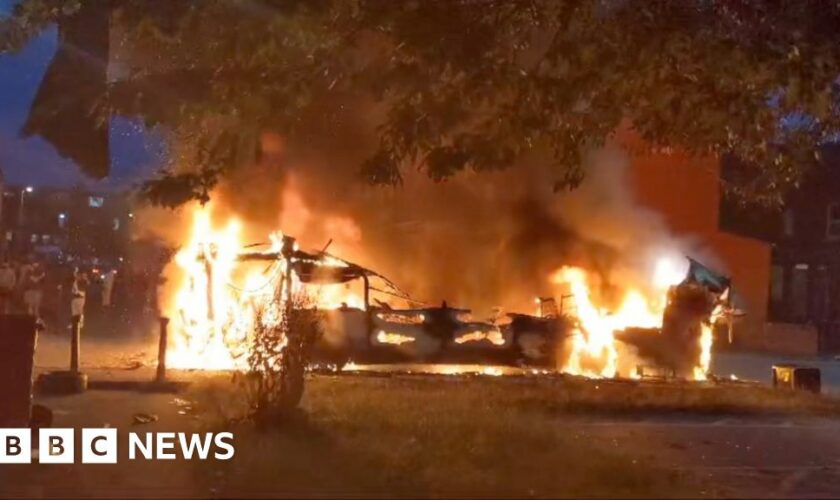 Bus on fire and police car overturned in disorder