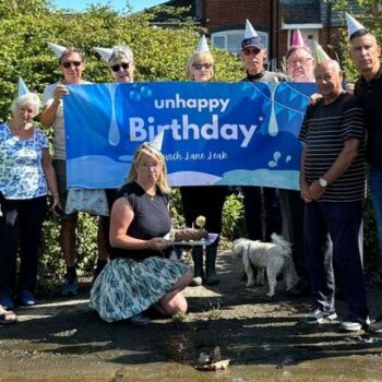 Furious residents hold 'unhappy birthday party' - for two-year-old water leak