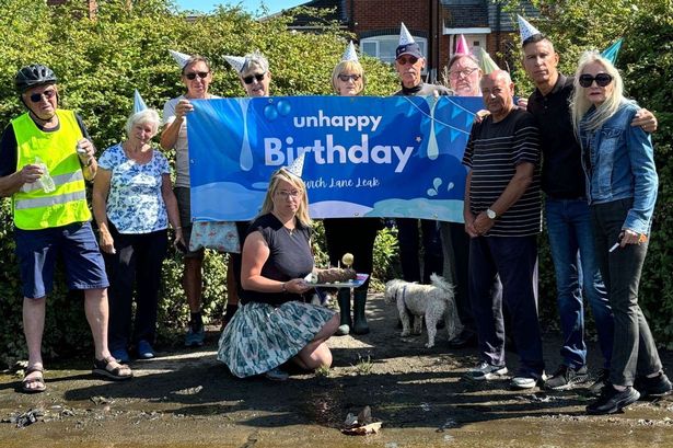 Furious residents hold 'unhappy birthday party' - for two-year-old water leak