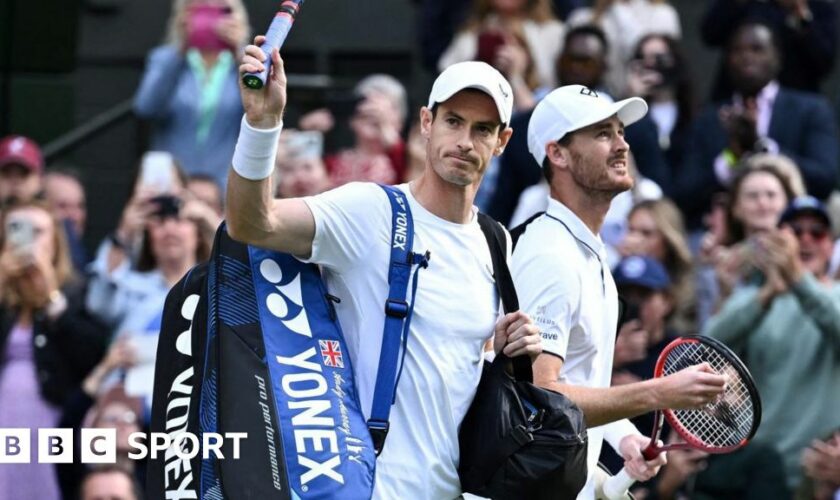 Andy Murray waves to the Wimbledon crowd as he walks out onto Centre Court