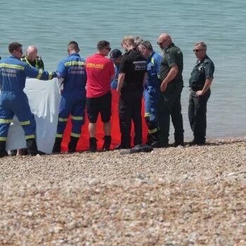 Seaford beach chaos as man's body found with black tarpaulin sheets across sand