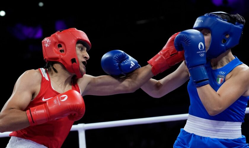 Algeria's Imane Khelif, left, fights Italy's Angela Carini in their women's 66kg preliminary boxing match at the 2024 Summer Olympics, Thursday, Aug. 1, 2024, in Paris, France. (AP Photo/John Locher)