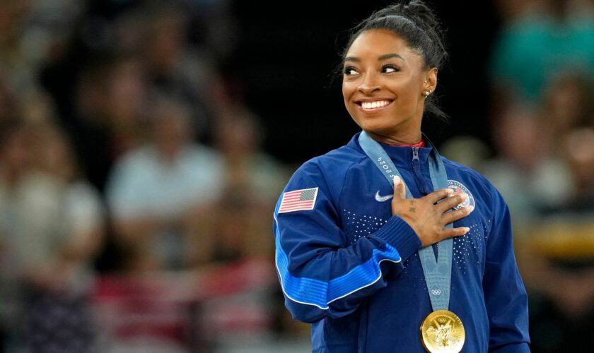 Aug 3, 2024; Paris, France; Simone Biles of the United States during the national anthem with her gold medal during the medal ceremony for the vault on the first day of gymnastics event finals during the Paris 2024 Olympic Summer Games at Bercy Arena. Pic: Reuters