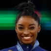 Paris 2024 Olympics - Artistic Gymnastics - Women's Vault Victory Ceremony - Bercy Arena, Paris, France - August 03, 2024. Gold medallist Simone Biles of United States celebrates on the podium with her medal. REUTERS/Hannah Mckay