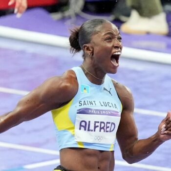 Julien Alfred, of Saint Lucia, celebrates after winning the women's 100 meters final at the 2024 Summer Olympics, Saturday, Aug. 3, 2024, in Saint-Denis, France. Pic: AP