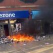 Far-right rioters loot shops and set fire to library and food bank in shameless day of disorder