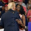 Trump embraces MAGA activist at Atlanta rally who repeats his offensive claims about Harris’ heritage