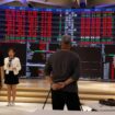 Media members report in front of screens showing trading data at the Taiwan Stock Exchange in Taipei, Taiwan August 6, 2024. REUTERS/Carlos Garcia Rawlins