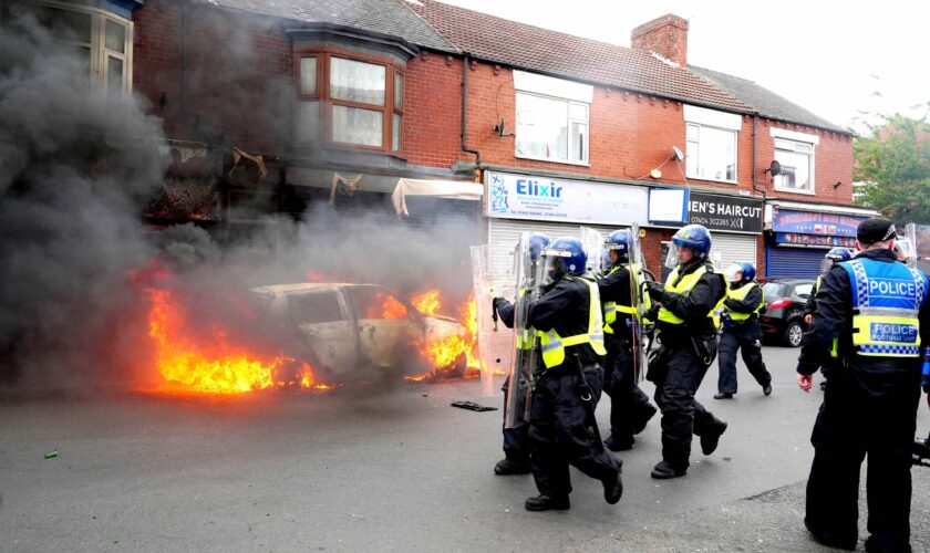 A car was set on fire by rioters in Middlesbrough on Sunday 4 August. Pic: PA