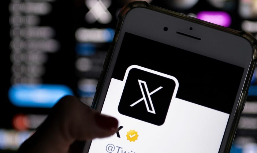 24 July 2023, Berlin: ILLUSTRATION - Twitter's official profile on a smartphone screen features the white letter X on a black background. Twitter owner Musk is trying to establish X as the new name for the short messaging service. Photo by: Monika Skolimowska/picture-alliance/dpa/AP Images