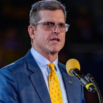 NCAA determines former Michigan coach Jim Harbaugh committed recruiting violations, issues penalty