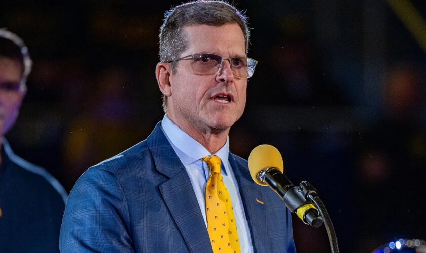 NCAA determines former Michigan coach Jim Harbaugh committed recruiting violations, issues penalty