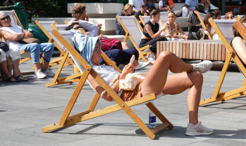 People out enjoying hot weather this month in Spitalfields, London. Pic: PA