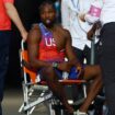 Noah Lyles receiving medical attention after the race. Pic: AP