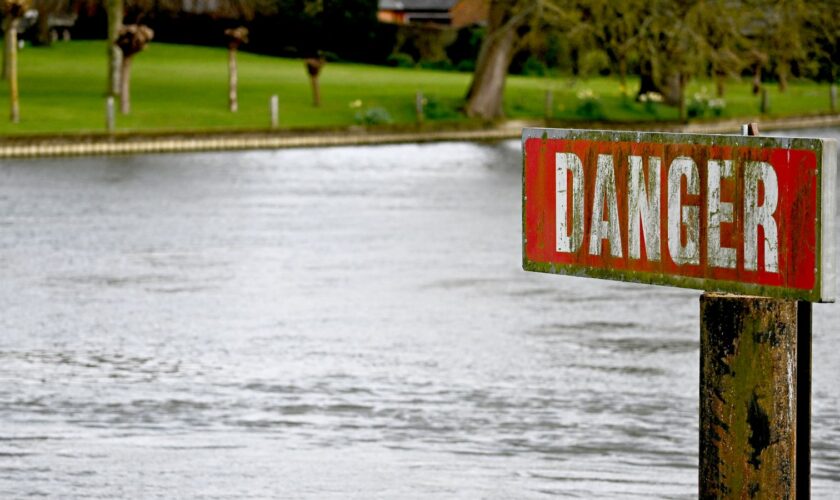 A "Danger" sign is seen on the River Thames, on the day data revealed sewage spills into England's rivers and seas by water companies more than doubled last year, in Hambledon, Britain, March 27, 2024. REUTERS/Dylan Martinez