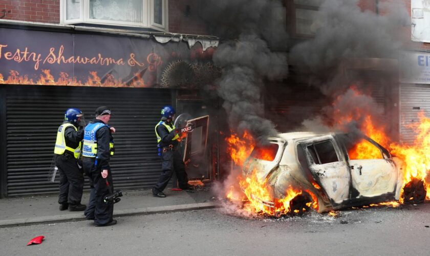 A car burns on Parliament Road, in Middlesbrough, during an anti-immigration protest. Picture date: Sunday August 4, 2024.