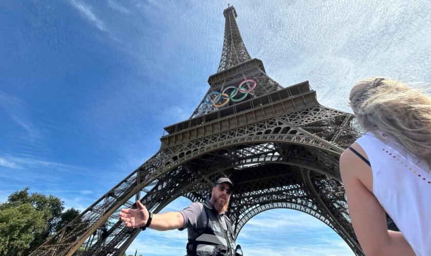 The area around the Eiffel Tower was evacuated after a man climbed up the historic landmark. Pic: AP