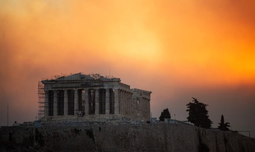 Greece wildfires - latest: Historic town faces ‘biblical catastrophe’ as wall of fire burns near Athens