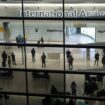 FILE - People in the arrivals area at Heathrow Airport in London, Jan. 26, 2021. The British government says it will grant extensions to several large U.K. airports unable to meet the June 1 deadline to fully install new scanning technology that would have allowed passengers to take two liters (70 ounces) of liquid in their hand luggage ... rather than the current paltry 100 milliliters (3.5 ounces). (AP Photo/Matt Dunham, File)