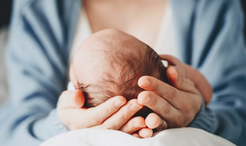 Newborn in mother's hands. Baby care. Childbirth and motherhood concept. Mother and baby. Pic: iStock