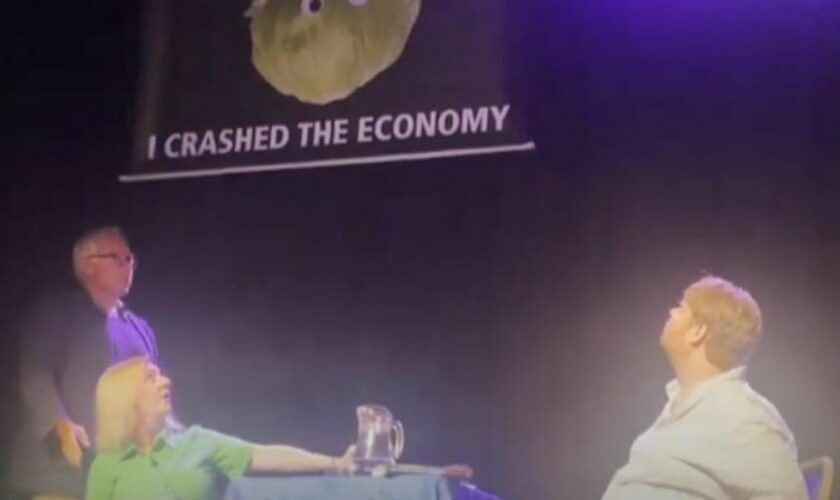 Liz Truss storms off stage after lettuce banner prank