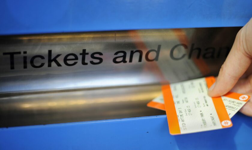 Undated file photo of a person buying a train ticket. Picture by  Lauren Hurley/PA Wire/PA Images