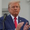 Donald Trump applauds during a press conference at Trump National Golf Club, in Bedminster, New Jersey