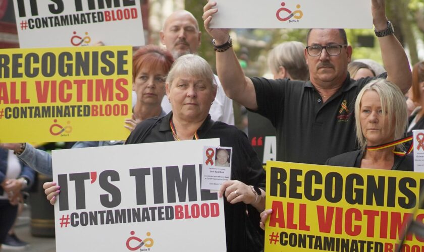 Infected blood scandal campaigners demonstrate outside Westminster in July 2023