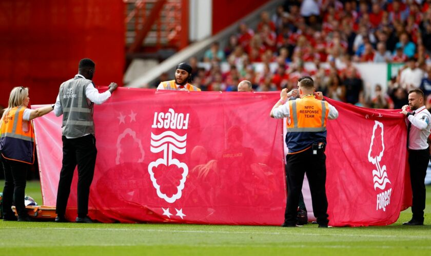 Nottingham Forest's Danilo receives medical attention behind a protective screen. Pic: Action Images via Reuters