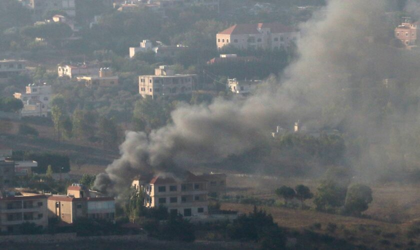 Smoke rises from the southern Lebanese town of Khiam, amid ongoing cross-border hostilities between Hezbollah and Israeli forces, as pictured from Marjayoun, near the border with Israel, August 25, 2024. REUTERS/Karamallah Daher