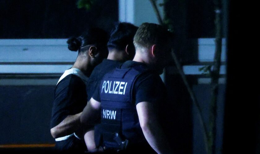 Police officers detain a person in Solingen, Germany. Pic: Reuters