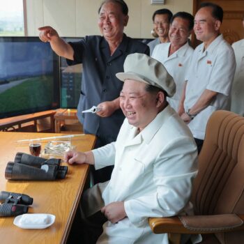 Kim Jong Un grins at 'successful testing of suicide drones'