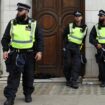 Police officers stand guard during the Notting Hill Carnival parade, in London, Britain, on August 26, 2024. REUTERS/Hollie Adams