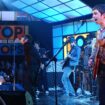 Noel Gallagher, right, and Liam Gallagher, of Oasis, appears on the television show "Top of the Pops" at BBC TV Studios in 2002. (AP Photo/Mark Allan)