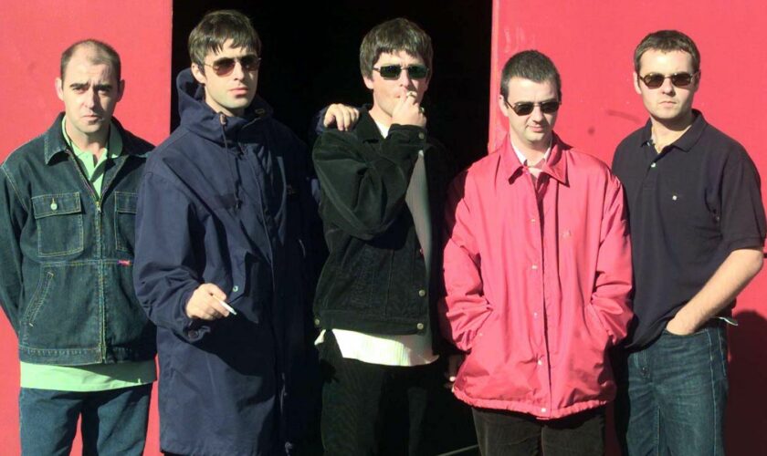 Oasis pictured in 1997 (L-R): Paul 'Bonehead' Arthurs, Liam Gallagher, Noel Gallagher, Paul 'Guigsy' McGuigan and Alan White. Pic: Reuters