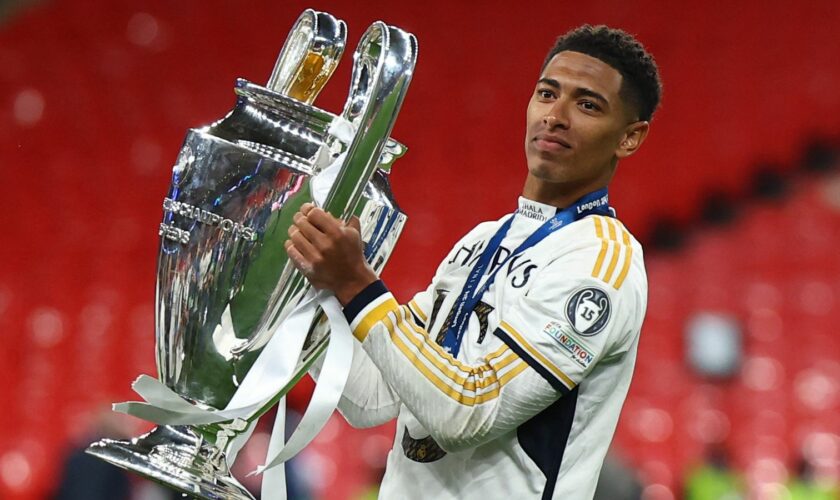 Soccer Football - Champions League - Final - Borussia Dortmund v Real Madrid - Wembley Stadium, London, Britain - June 1, 2024 Real Madrid's Jude Bellingham celebrates with the trophy after winning the Champions League REUTERS/Hannah Mckay