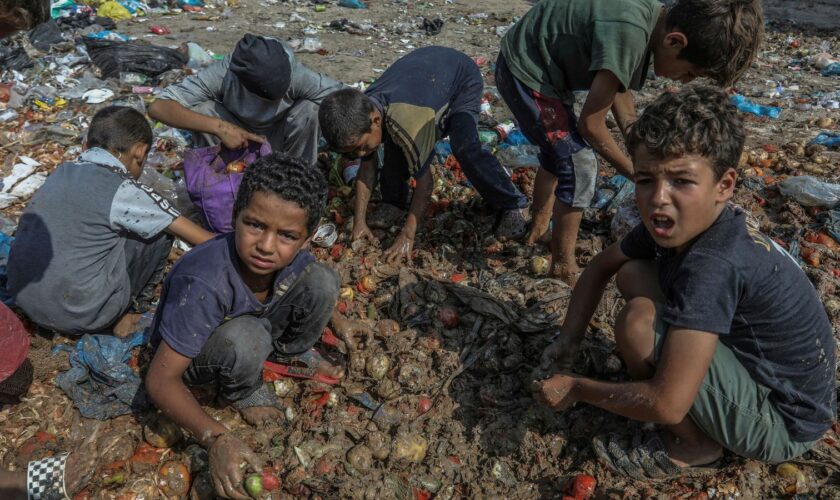 Palestinian children search for food in Deir al-Balah. Pic: AP