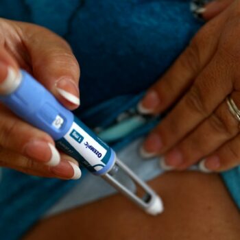 Kim Gradwell with an Ozempic injection needle at her home in Dudley, North Tyneside, Britain, October 31, 2023. Gradwell, a retired receptionist with type 2 diabetes, was not able to get her prescription for Ozempic filled in July through the country’s public health system amid shortages of the medicine that is in high demand from people without diabetes seeking it for its weight-loss effect. REUTERS/Lee Smith