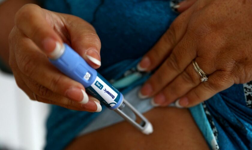 Kim Gradwell with an Ozempic injection needle at her home in Dudley, North Tyneside, Britain, October 31, 2023. Gradwell, a retired receptionist with type 2 diabetes, was not able to get her prescription for Ozempic filled in July through the country’s public health system amid shortages of the medicine that is in high demand from people without diabetes seeking it for its weight-loss effect. REUTERS/Lee Smith