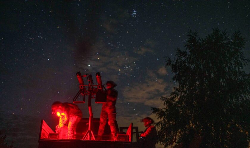 With men at the front lines, women watch over Ukraine's night sky for Russian drones