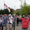 Balaclava-clad protesters swilling beer cans begin demo outside migrant hotel in Rotherham just hours after thugs tore cities apart in violent riots - as Keir Starmer is slammed for going on holiday while Britain burns