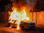 Boy, 11, is arrested on suspicion of arson after police car was set alight during protests in Hartlepool