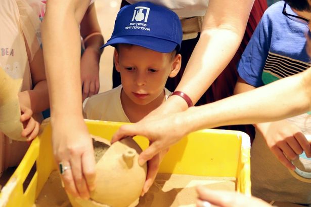 Boy, 4, who smashed priceless 3,500-year-old jar returns to museum to watch repairs