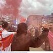 Britain braces for more riot mayhem: Masked protesters draped in England flags set off flares and attack cop cars in Sunderland, as police on horseback defend mosque from a large mob - amid fears of fresh far-right violence